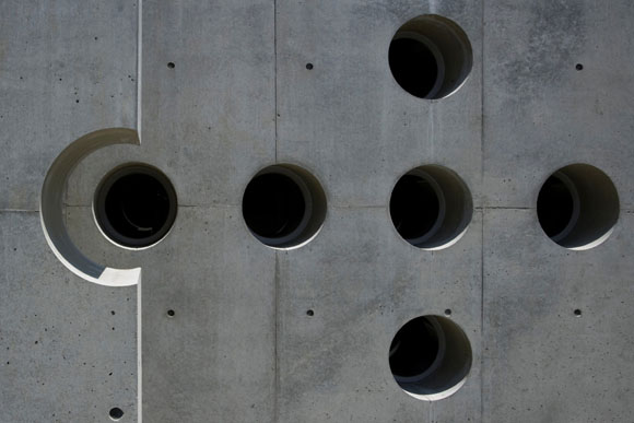 The holes are lined up on a cross shape. The hole is made on the architecture like the perforated line. This architecture is House with Crest.