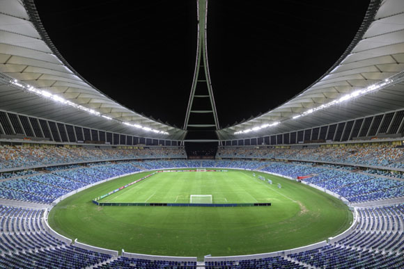 Situated on a raised platform, the multifunctional stadium is accessed from the south via a broad flight of steps. A 104m (two-pronged) arch curves high over the stadium as an emblem, visible far and wide. The main entrance at the end of a 2.5 km linear park coincides with the bifurcation of the arch, as a gateway to the city.